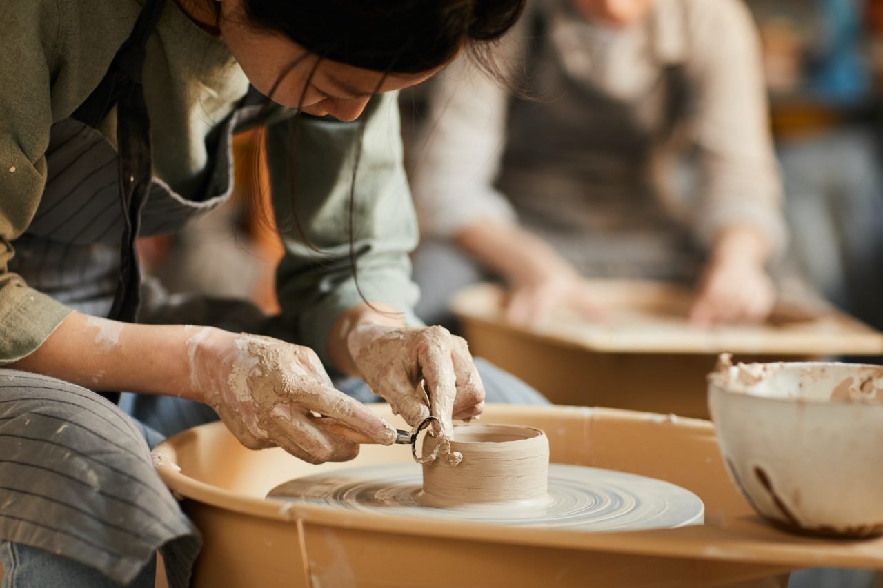 shaping-wet-clay-on-pottery-wheel.jpg